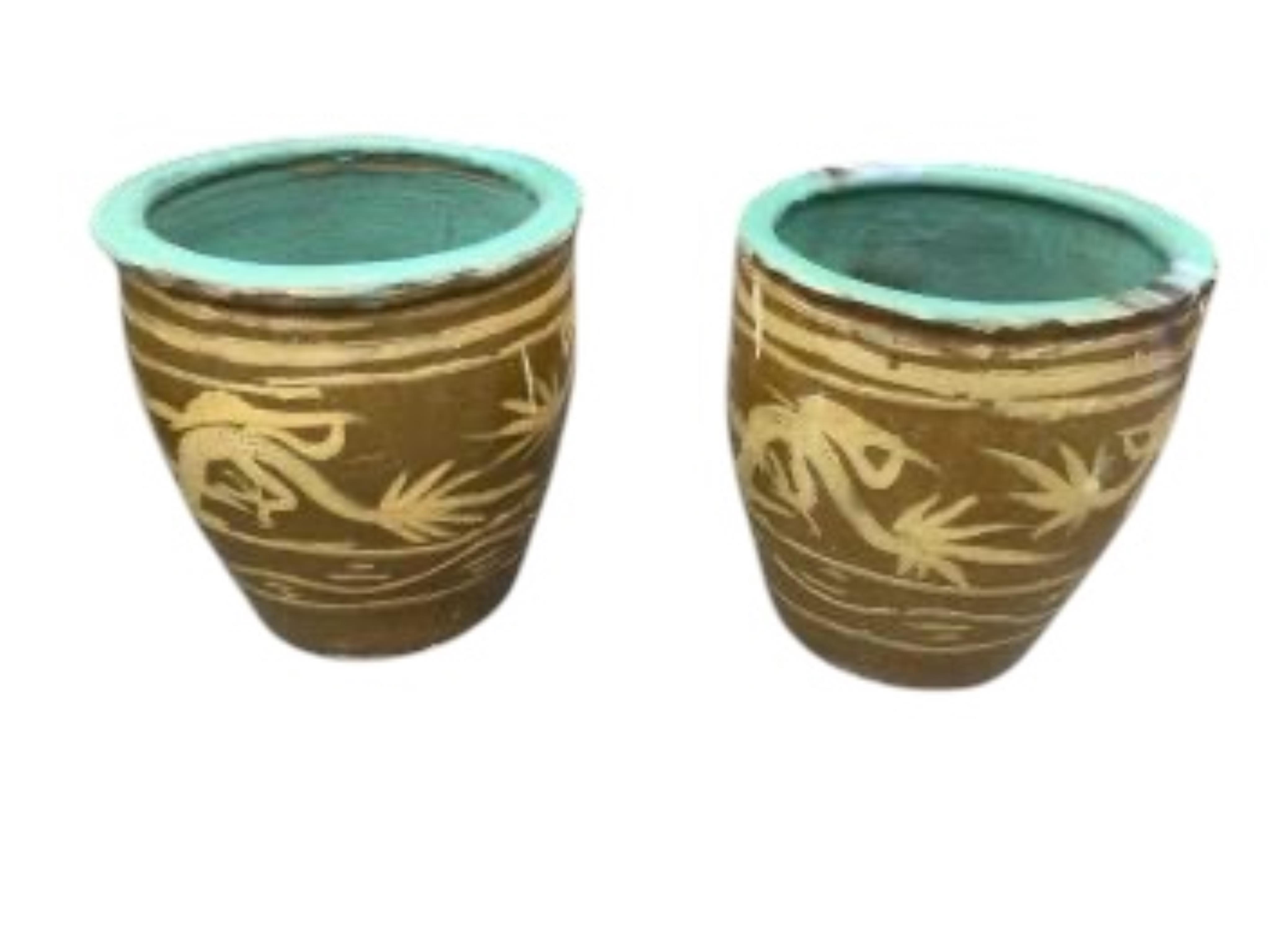 A pair of Chinese style circular earthenware garden planters, diameter 36cm, height 39cm